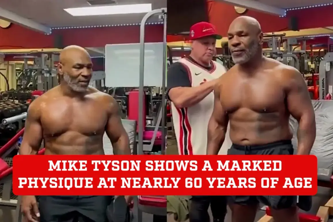 Mike Tyson's impressive physique at nearly 60 years old is on full display in a gym setting. His muscular build shows his continued dedication to fitness.