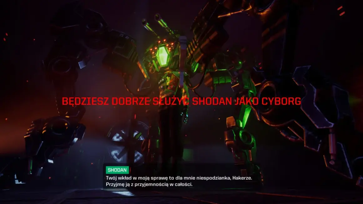 Potężny cyborg z zielonymi światłami i bronią groźnie patrzy na gracza. Tekst "BĘDZIESZ DOBRZE SŁUŻYĆ SHODAN JAKO CYBORG" sugeruje, że gracz stanie się częścią tej maszyny.