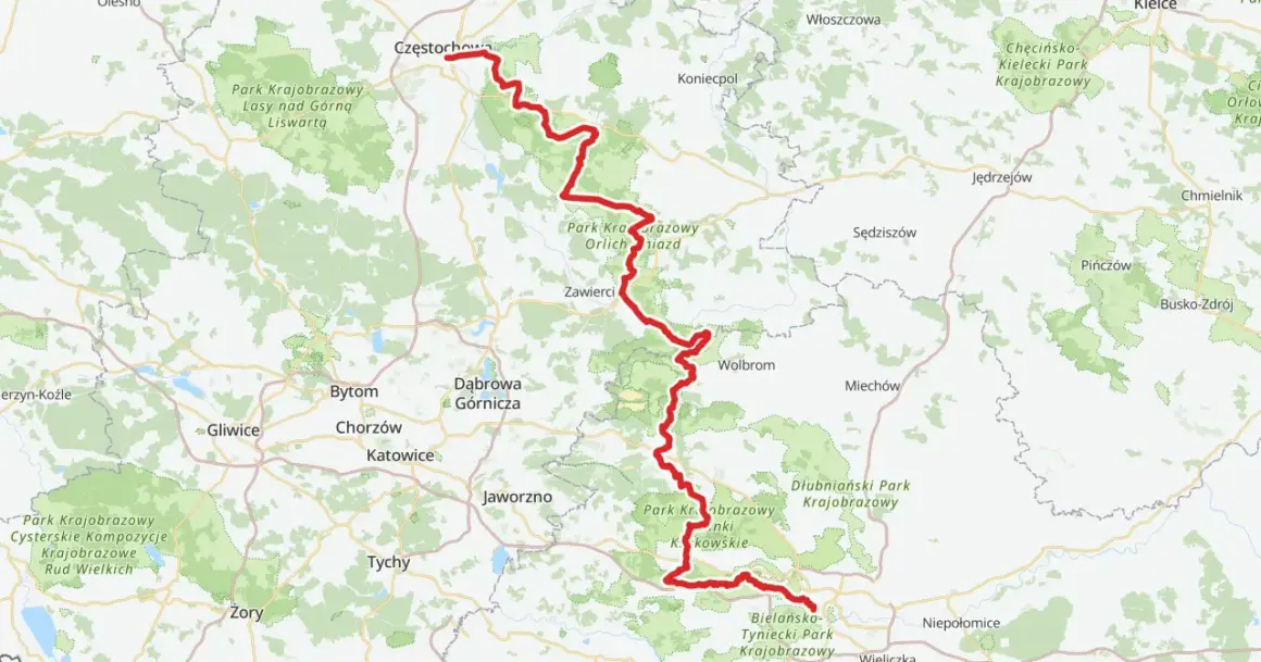 Mapa z zaznaczoną na czerwono trasą rowerową Szlak Orlich Gniazd, biegnącą przez malownicze tereny Jury Krakowsko-Częstochowskiej.
