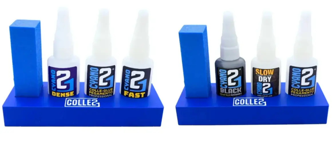 Deux présentoirs bleus avec des bouteilles de super glu CYANO 2 : DENSE, FAST, BLACK, SLOW DRY. Idéal pour les collages professionnels.