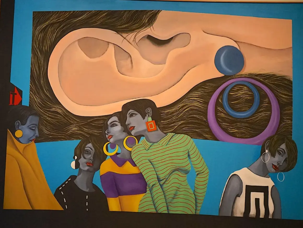 A surreal painting by hispanic artists features women with striking jewelry and bold outfits, set against a backdrop of a giant ear and swirling hair.
