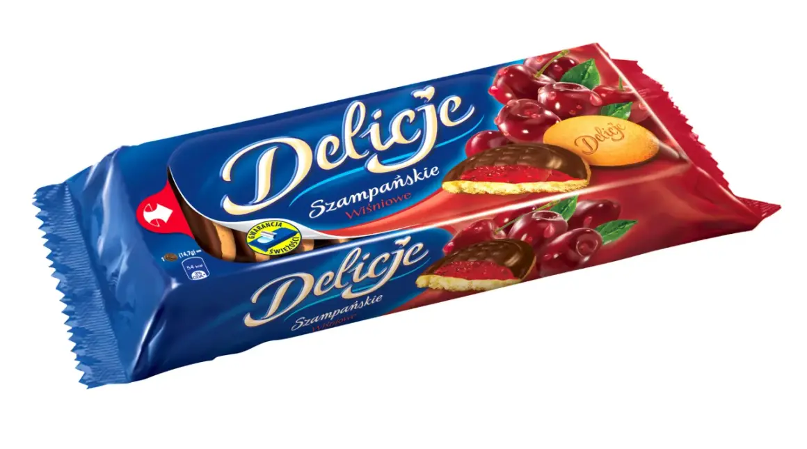 Opakowanie ciastek Delicje Szampańskie Wiśniowe z soczystymi wiśniami i czekoladą.