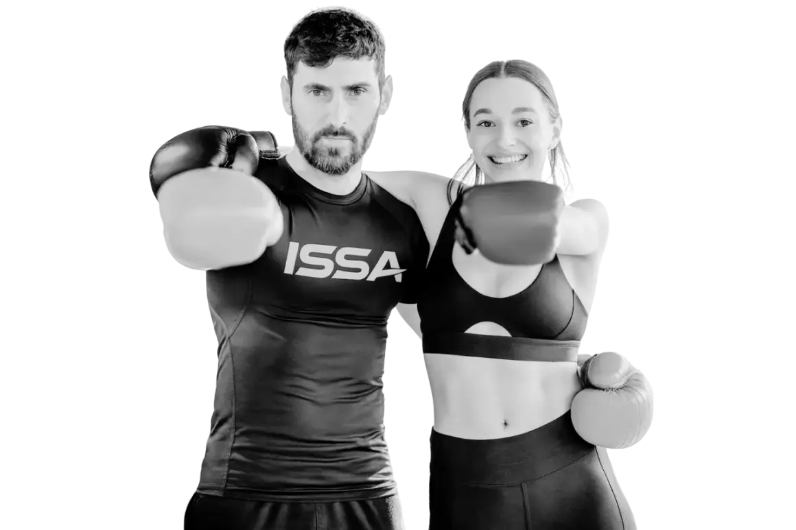 A man and woman in boxing gloves ready to punch, embodying the intensity of hiit boxing.