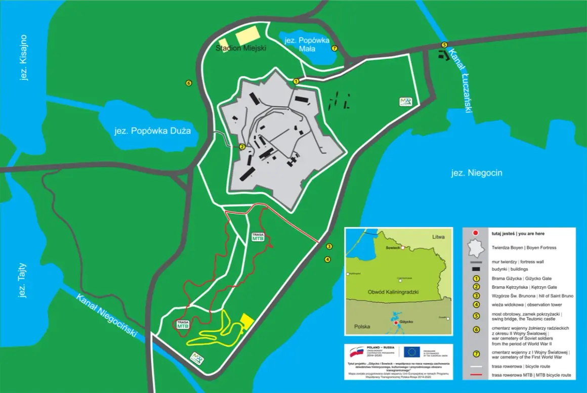 Mapa Giżycka z trasami rowerowymi, w tym szlakami MTB, prowadzącymi przez tereny Twierdzy Boyen i okolice jezior.