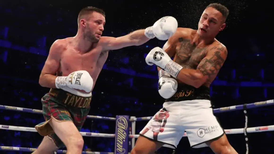 Boxer lands a punch, showcasing the intensity of a middleweight weight limit bout.