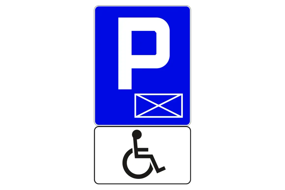 Znak P z kopertą i symbolem wózka inwalidzkiego. To indywidualne miejsce parkingowe dla osoby niepełnosprawnej.