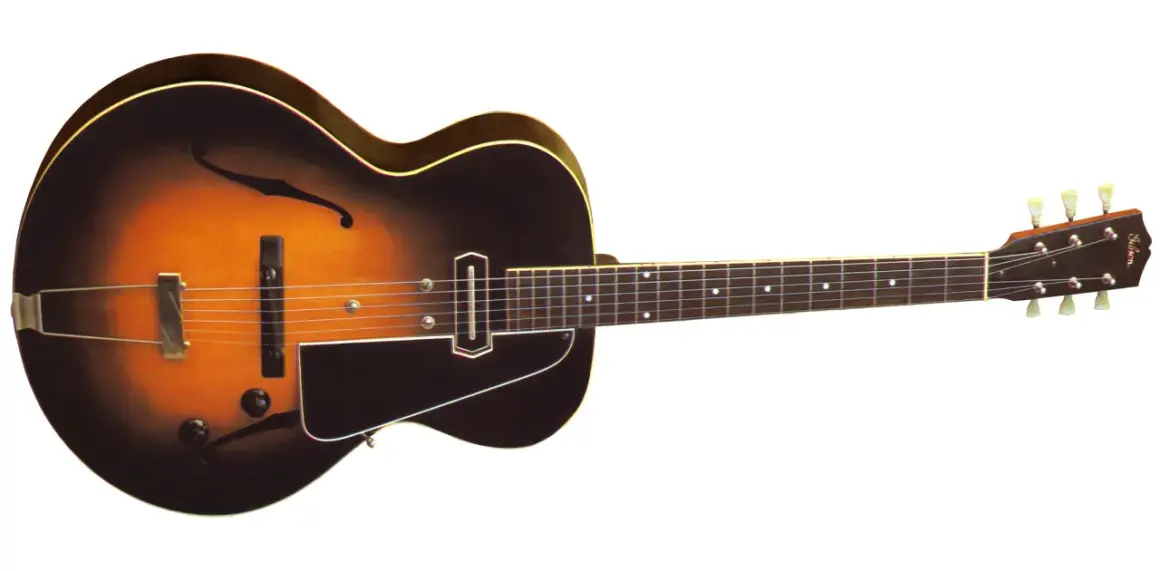 Klasyczna gitara elektryczna z wycięciami w kształcie litery "f", z przetwornikiem i kluczami. Może to być pierwsza gitara elektryczna, która rozpoczęła rewolucję w muzyce.