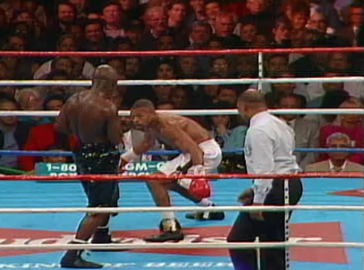 Roy Jones Jr. in the ring, a moment from what many consider his best fight. The crowd watches intently as he faces his opponent.