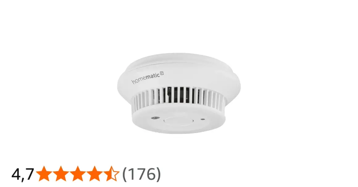 Homematic IP Rauchmelder im Test: Ein weißer, runder Rauchmelder mit Lüftungsschlitzen und einem zentralen Knopf.
