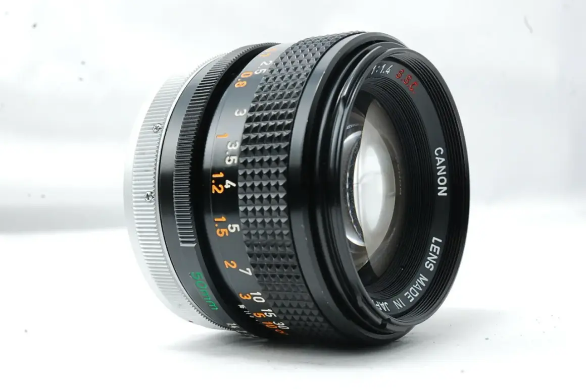 A Canon 50mm f/1.4 SSC lens, a contender for the best Canon FD lens, showcasing its aperture and focus rings.