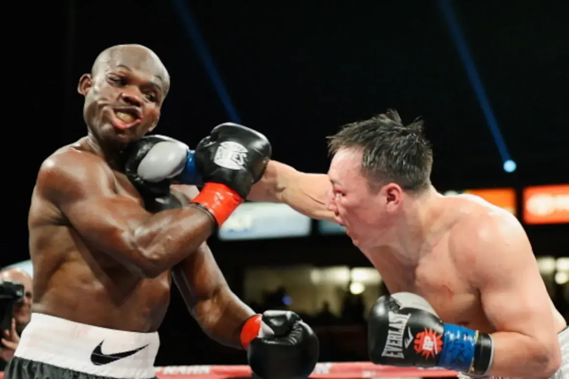 A boxer lands a punch on his opponent. The boxer on the left, with a determined grimace, is about to be hit. The boxer on the right, with a focused expression, delivers a powerful blow. This is a classic boxer vs brawler showdown.