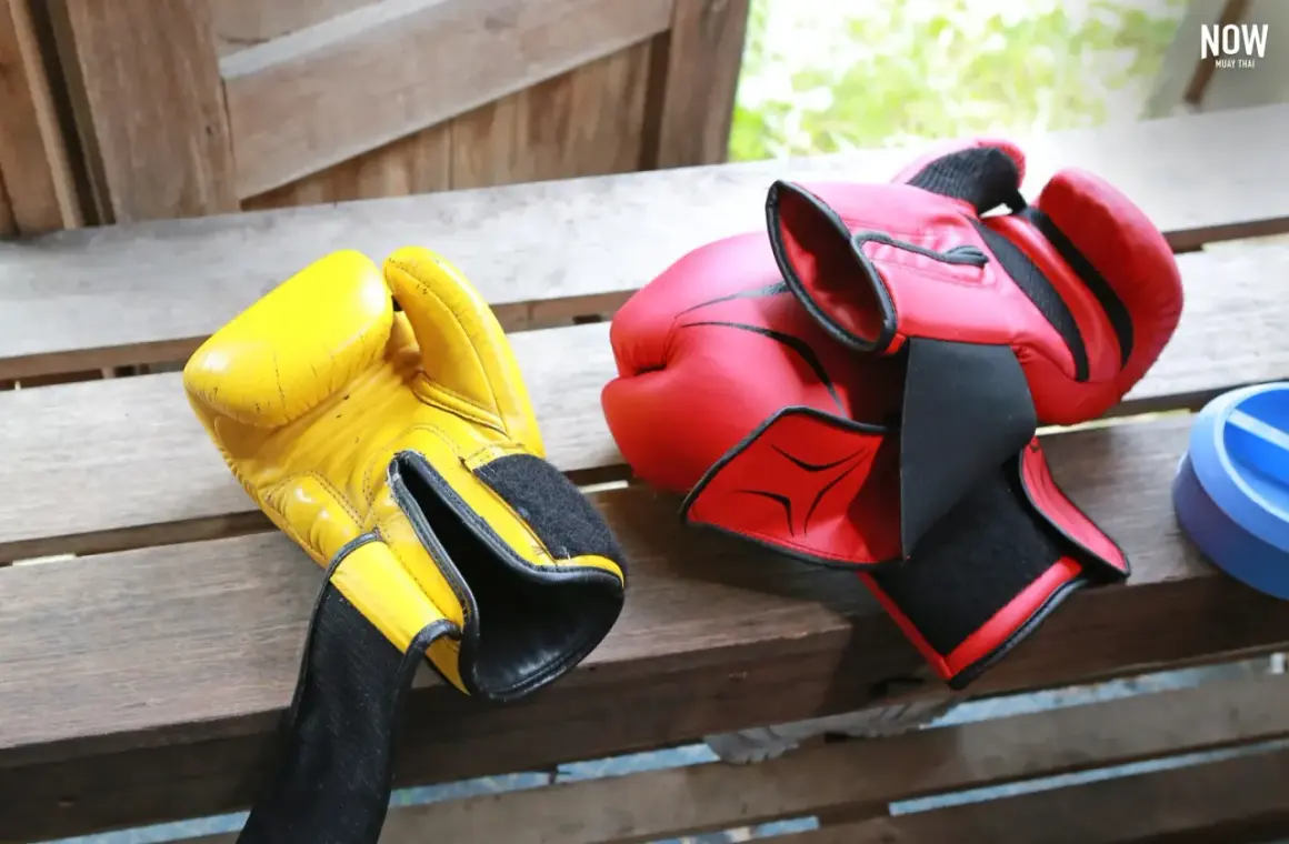 Yellow and red boxing gloves ready for a sparing sport session.