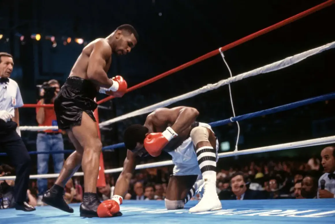 Mike Tyson lands a powerful punch, sending his opponent to the canvas. A classic example of the best Mike Tyson knockouts.