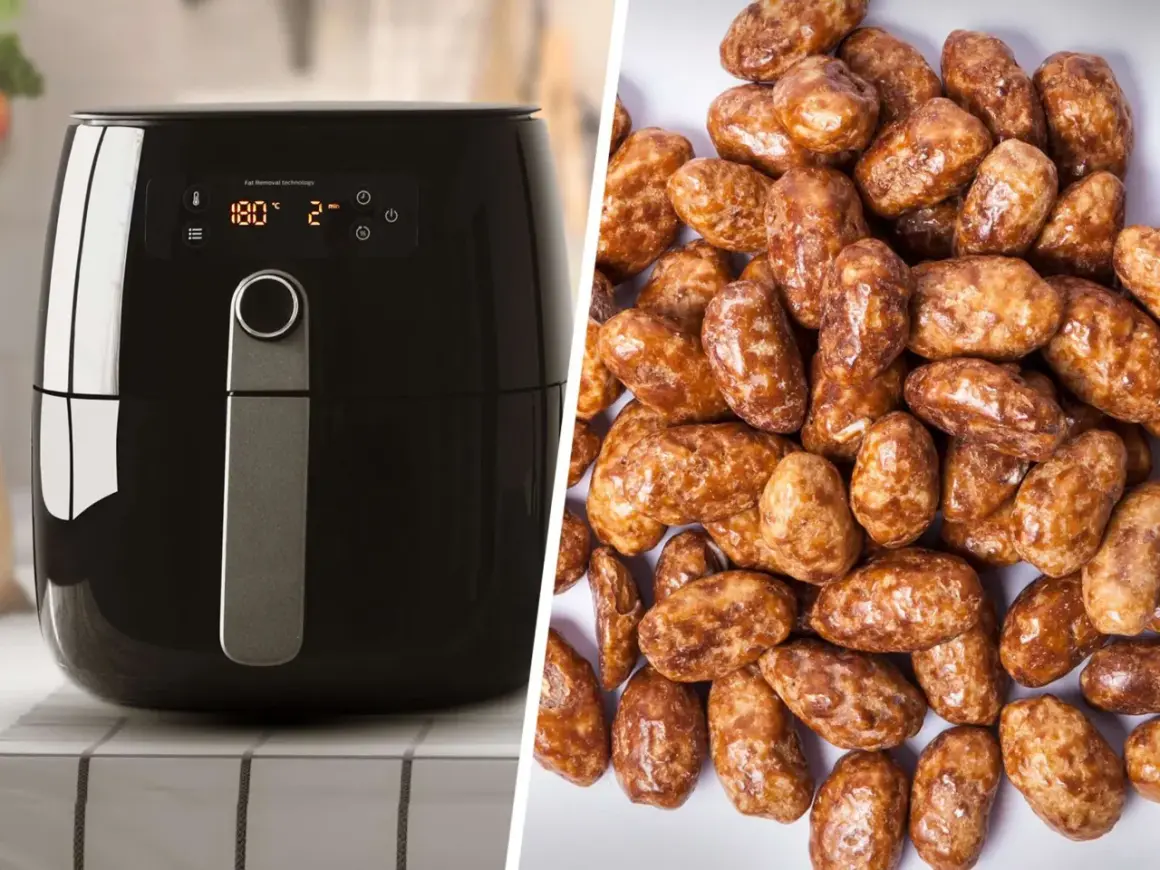 Schwarzer Airfryer neben einem Haufen glänzender, karamellisierter gebrannter Mandeln. Perfekt für süße Snacks!