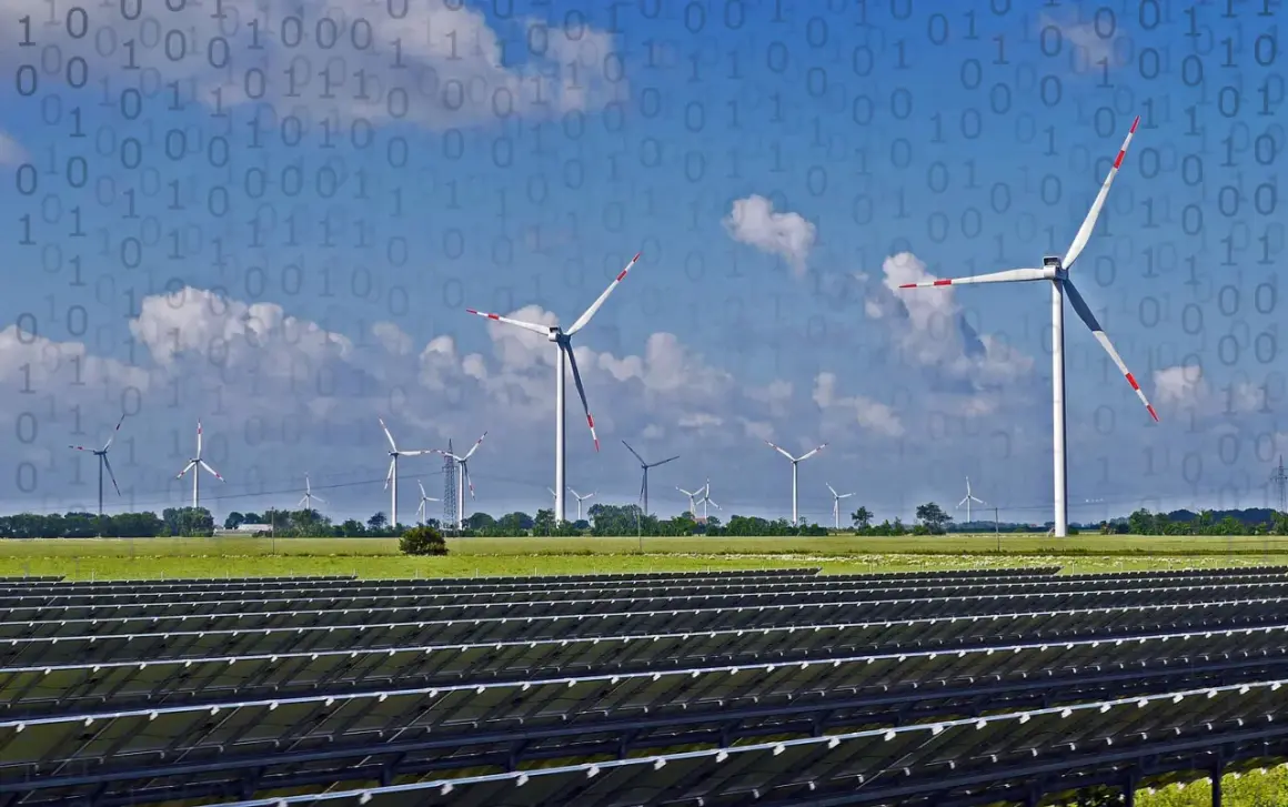 Panele słoneczne i wiatraki na tle nieba z cyfrowym kodem. Przyszłość rolnictwa ekologicznego w danych.
