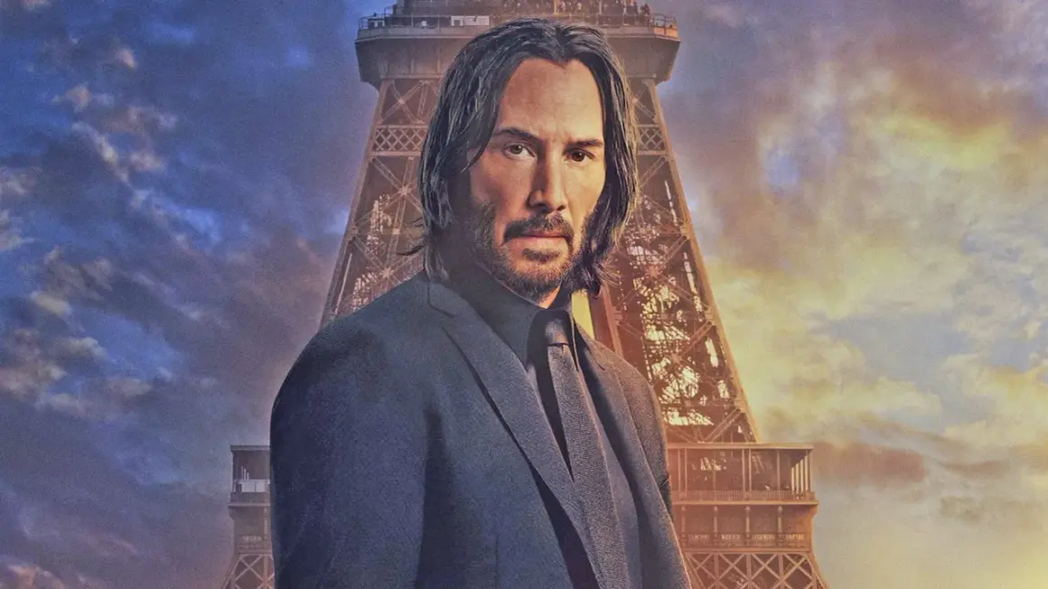 John Wick, im Anzug vor dem Eiffelturm, bereit für John Wick 5.