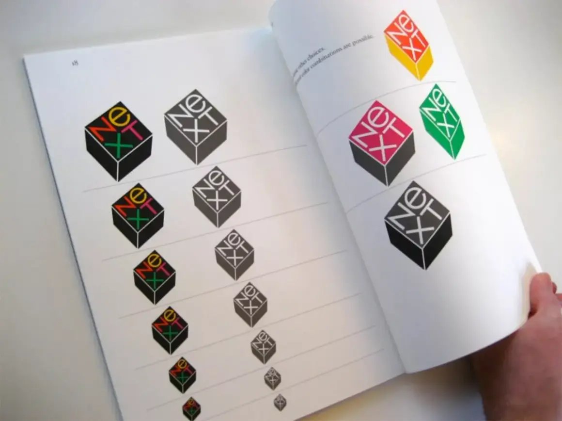 A book page displays variations of the iconic "NeXT" logo, showcasing Paul Rand's famous works and exploring different color combinations.