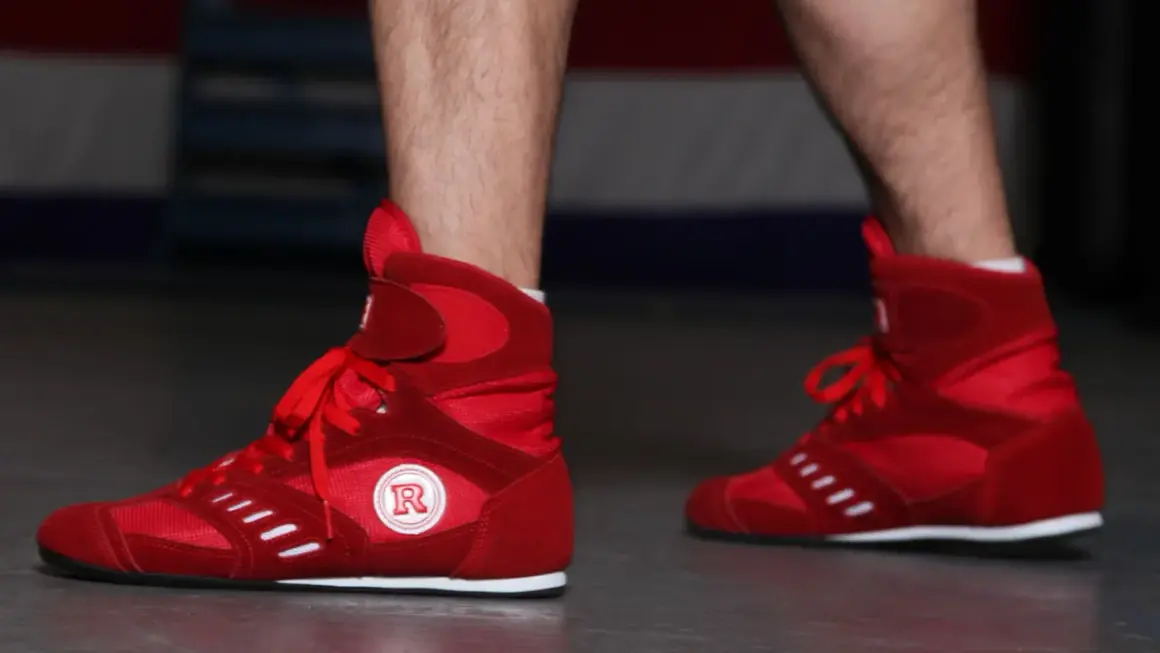 Red boxing shoes ready for intense boxing footwork drills.