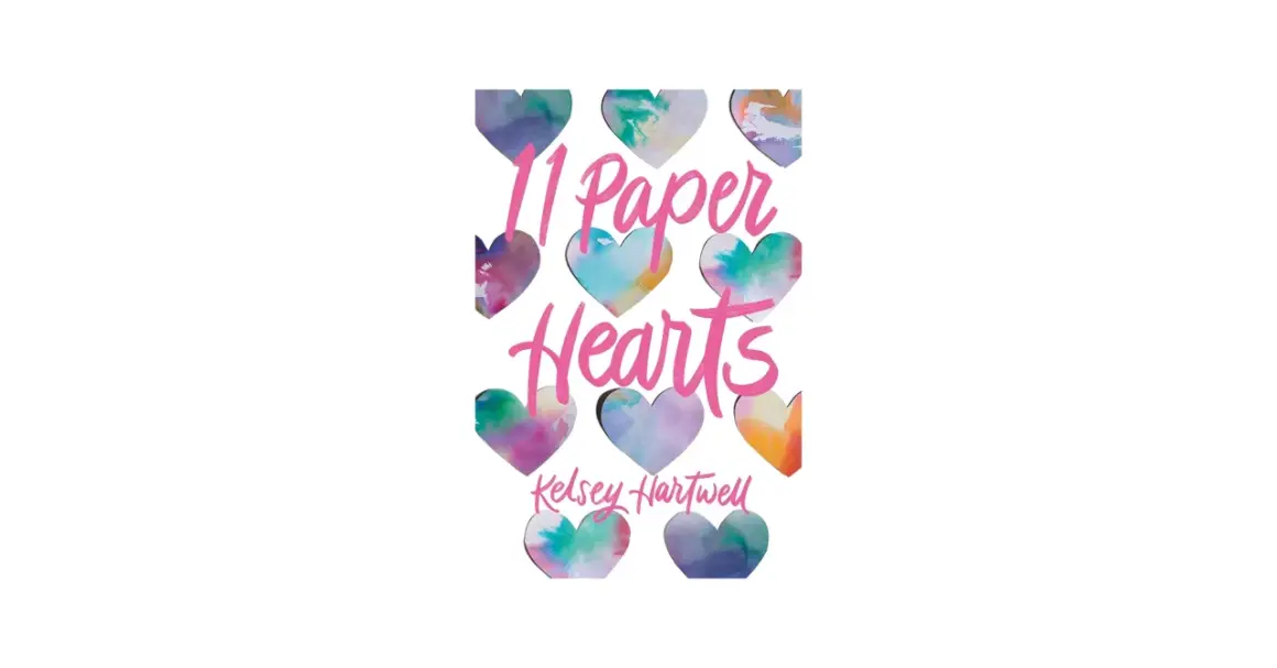 11 papierowych serc w akwarelowych barwach, tworzących tytuł "11 Paper Hearts" i nazwisko Kelsey Hartwell.