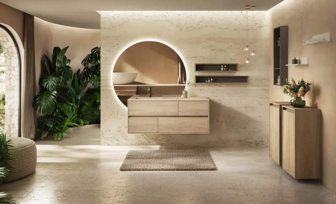 Salle de bain moderne avec plantes luxuriantes, meuble vasque en bois flottant et miroir rond lumineux. Idées pour comment décorer une salle de bain avec une touche naturelle.