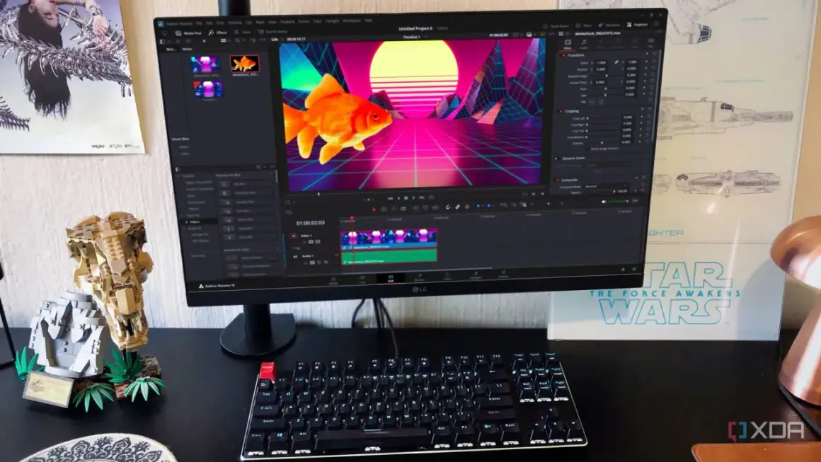 A computer monitor displays DaVinci Resolve, showing a goldfish in a retro neon landscape. This setup hints at a comparison between davinci resolve vs after effects for video editing.