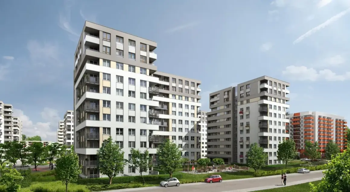 Nowoczesne budynki mieszkalne na osiedlu Avia Kraków. Zieleń, chodniki i samochody tworzą przyjazną przestrzeń.