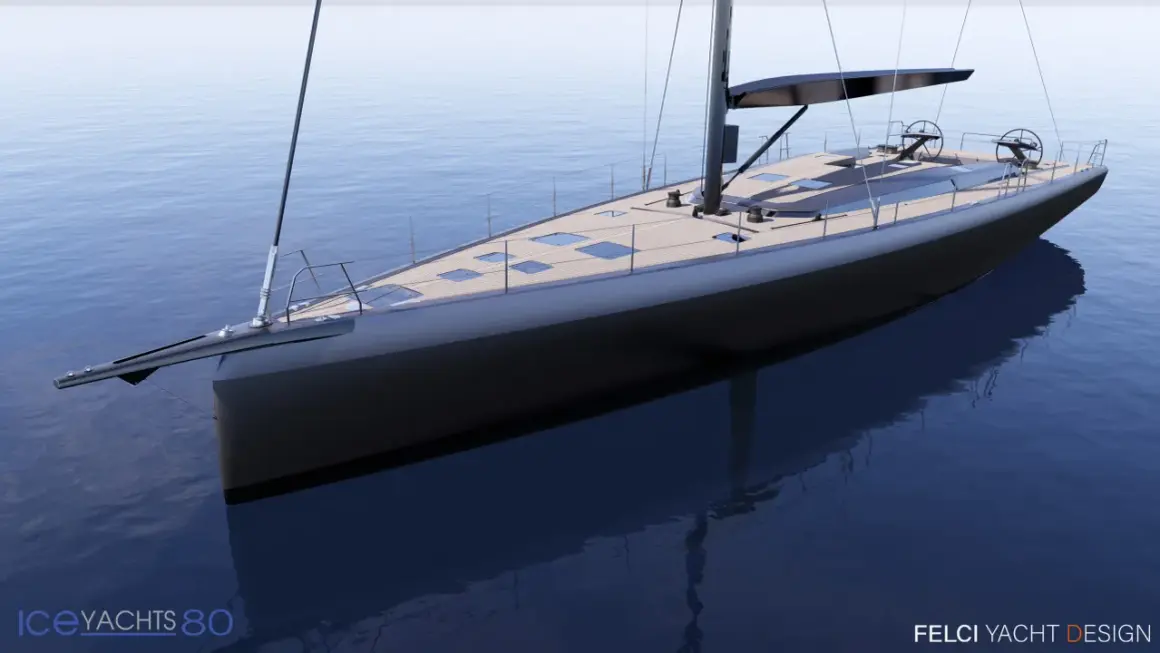 A sleek, modern sailboat with a dark hull and wooden deck glides on calm blue water.
