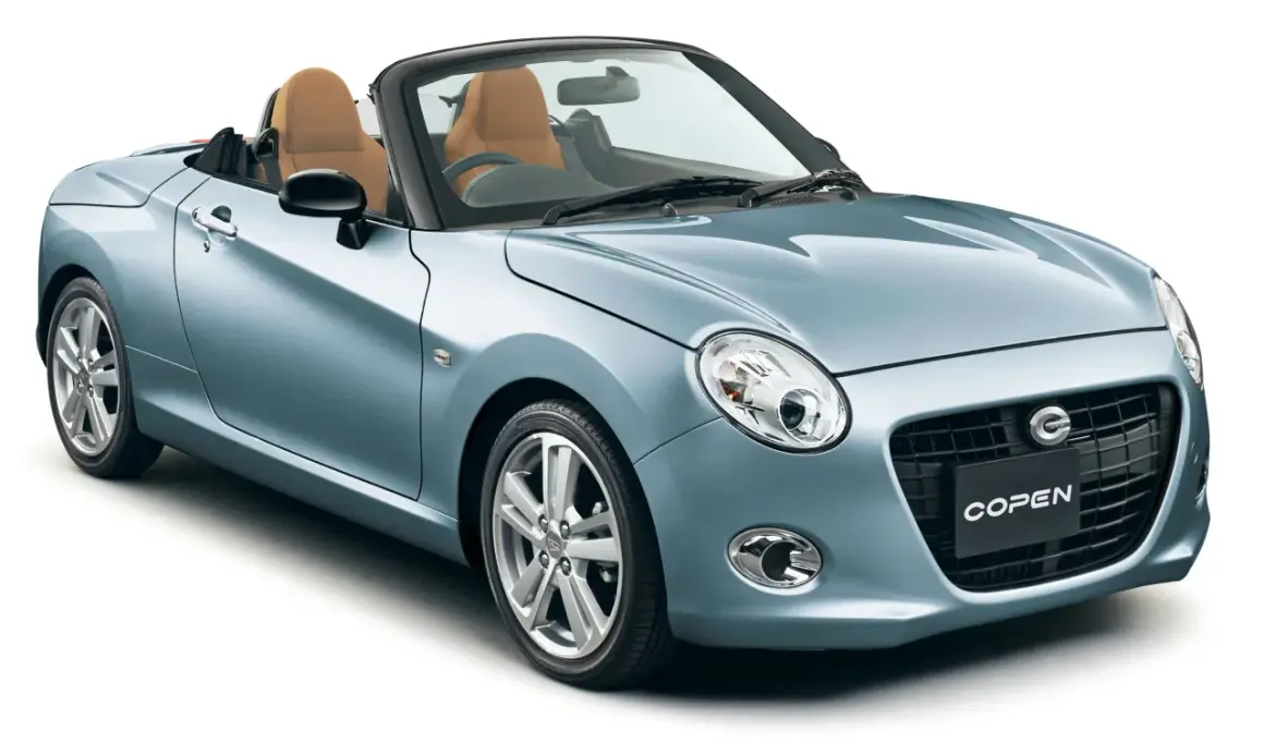Niebieski kabriolet kei car z brązowymi skórzanymi siedzeniami, idealny na letnie przejażdżki.