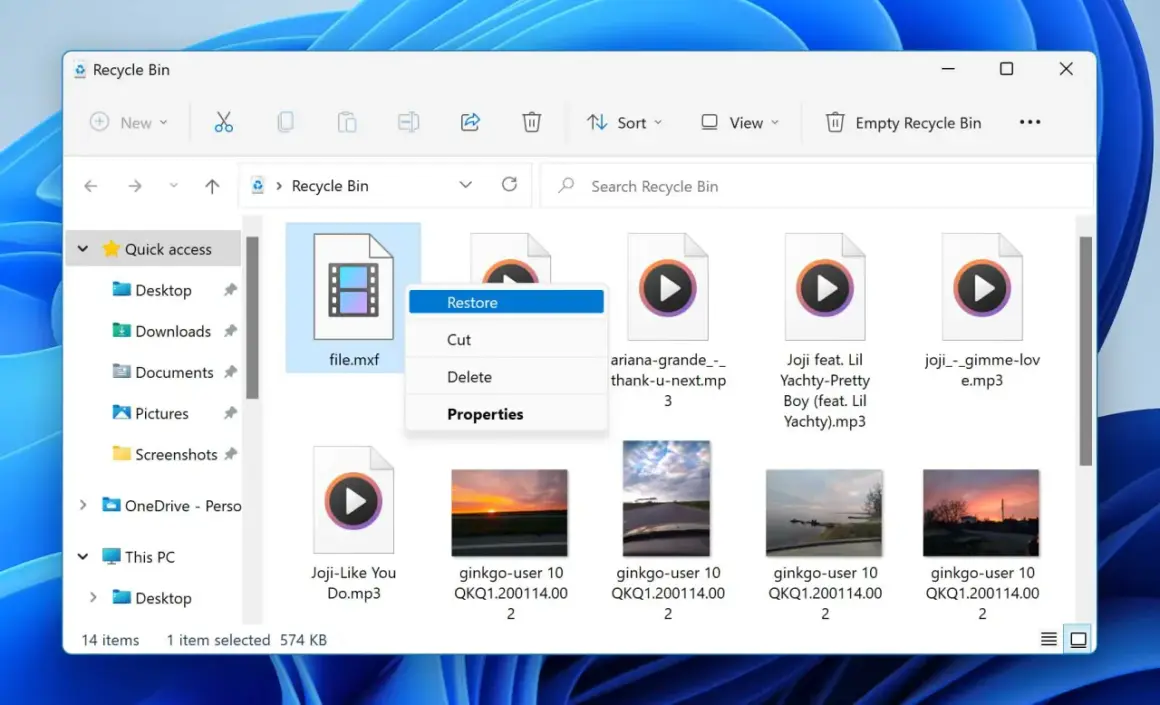 Recycle Bin shows a deleted file.mxf, a video file, with a context menu open offering to restore it.