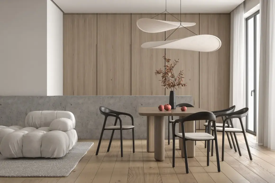 Jadalnia w stylu minimalistycznym: drewniane panele, betonowy blat, jasna sofa, drewniany stół z krzesłami i ozdobna lampa.