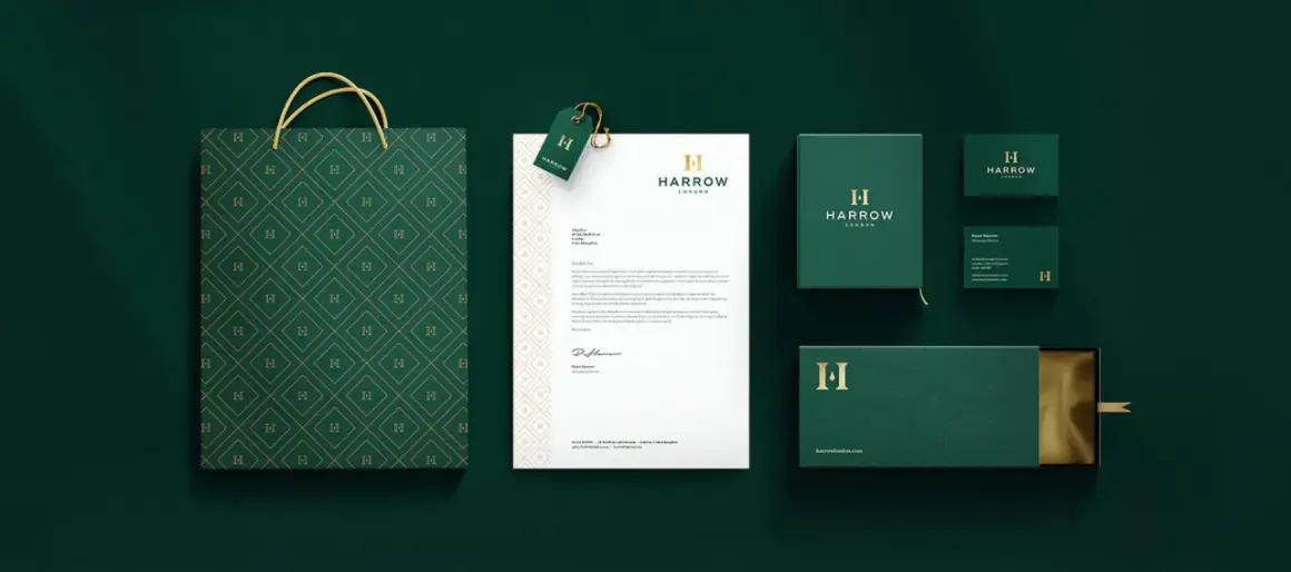 A sophisticated brand identity featuring a monogram logo with the letter "H" on a shopping bag, stationery, and packaging.