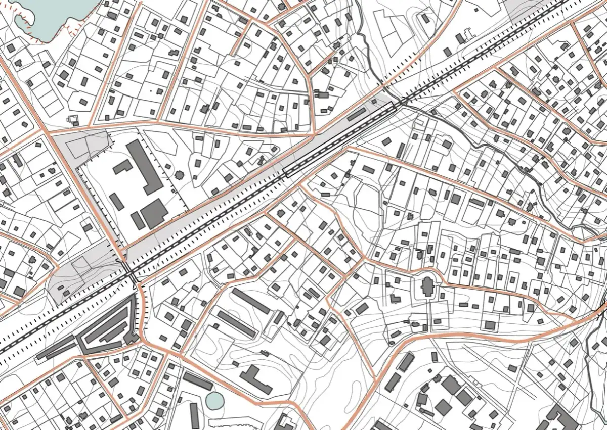 Szczegółowa mapa sytuacyjno wysokościowa z zaznaczonymi budynkami, drogami i liniami kolejowymi.