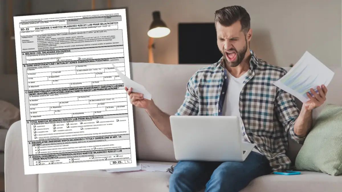 Mężczyzna z wściekłą miną trzyma dokumenty i laptopa, próbując zrozumieć formularz SD-Z2.