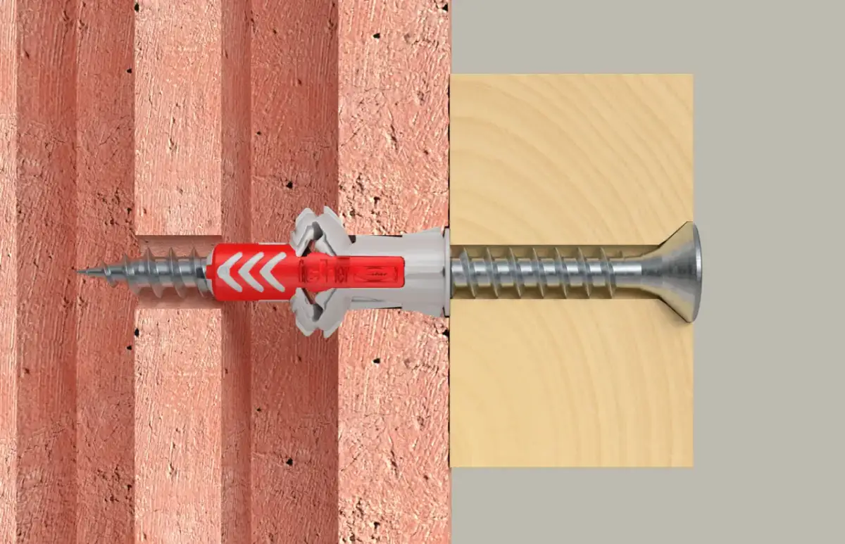 Cegła dziurawka: Jak bezpiecznie mocować? Wybierz kołek i technikę!