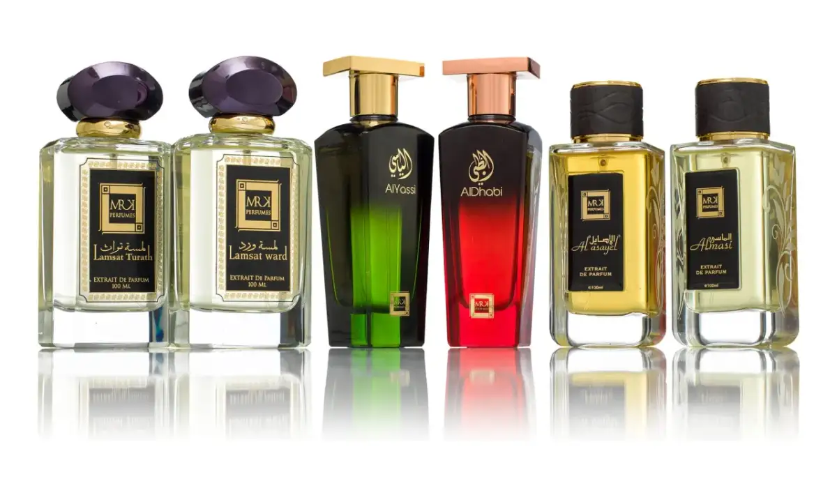 Kolekcja sześciu luksusowych perfum niszowych, każdy w eleganckiej butelce z ozdobnym korkiem.