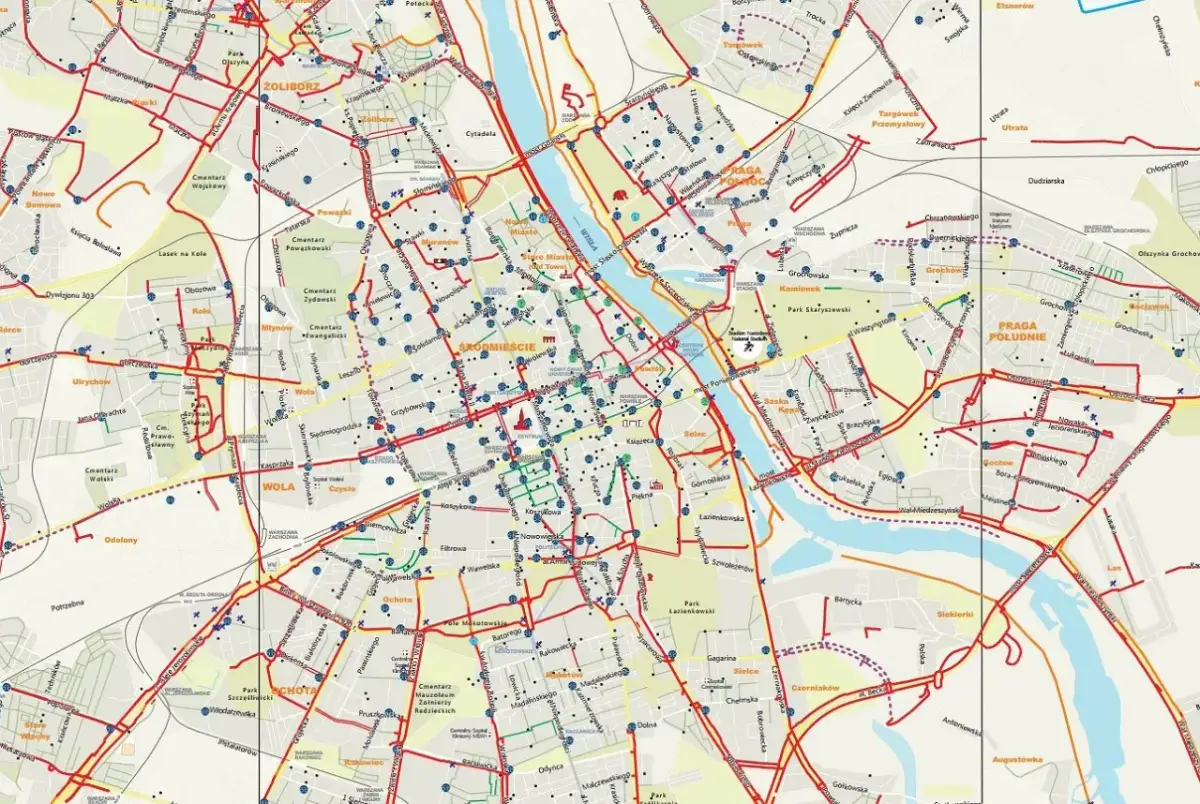 Mapa tras rowerowych Warszawy. Czerwone linie pokazują ścieżki rowerowe, a niebieskie punkty to stacje Veturilo.