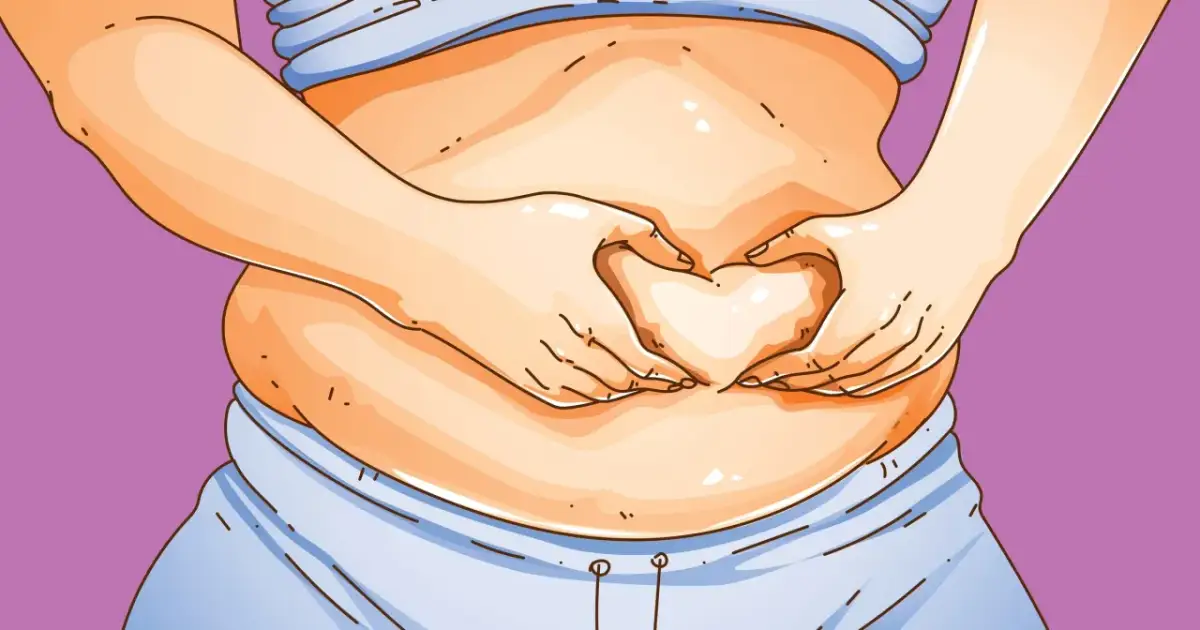 Dłonie tworzą serce na brzuchu, symbolizując troskę o zdrowie i chęć, jak spalić tłuszcz trzewny.