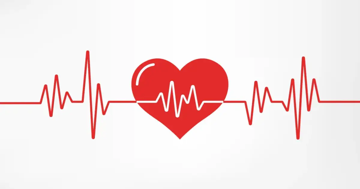 Czerwone serce z linią EKG na białym tle.