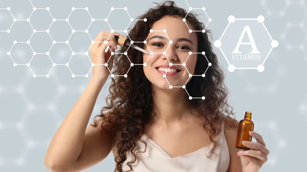 Kobieta z serum na twarzy, symbolizującym, jak działa retinol. W tle grafika przedstawiająca cząsteczki i witaminę A.