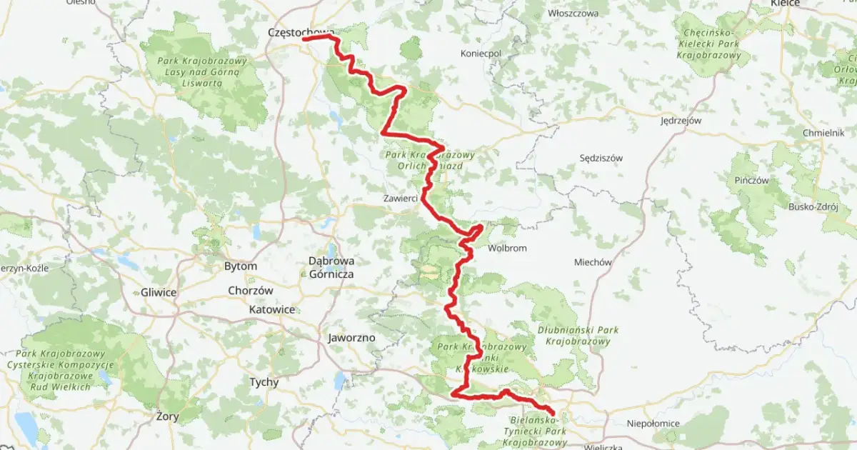 Mapa z zaznaczoną na czerwono trasą rowerową Szlak Orlich Gniazd, biegnącą przez malownicze tereny Jury Krakowsko-Częstochowskiej.