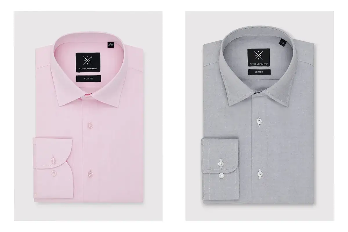 Dwie koszule męskie, różowa i szara, z widocznymi metkami "SLIM FIT".