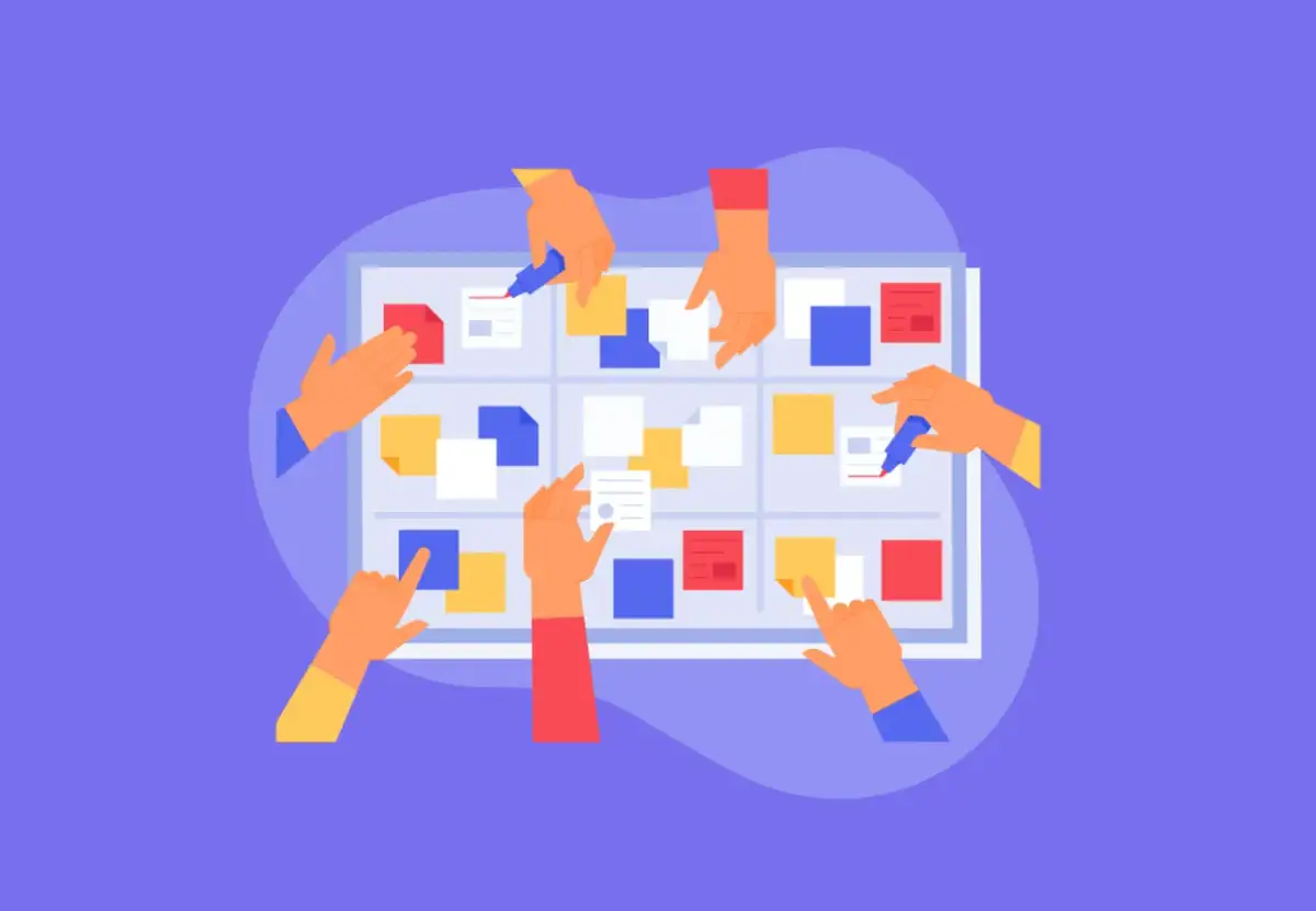 Ręce dodają i przesuwają karteczki na tablicy Kanban.