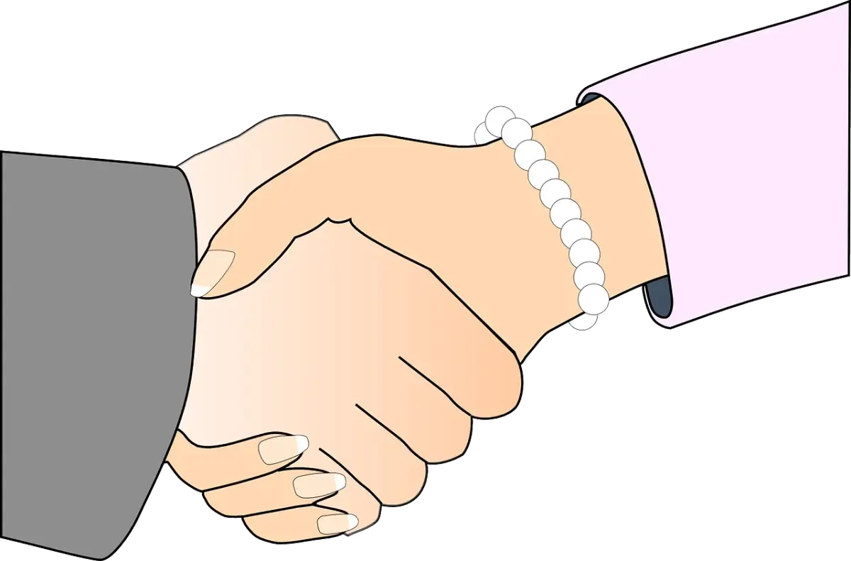 Dwie dłonie ściskają się w uścisku. Jedna dłoń, ozdobiona bransoletką z pereł, podaje rękę.