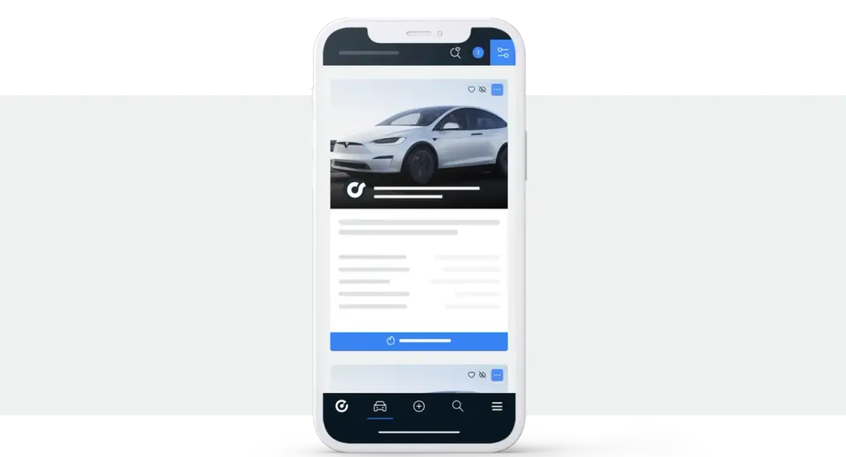 Aplikacja mobilna pokazująca białe auto. Tu handlarze kupują auta w Niemczech, szukając okazji.