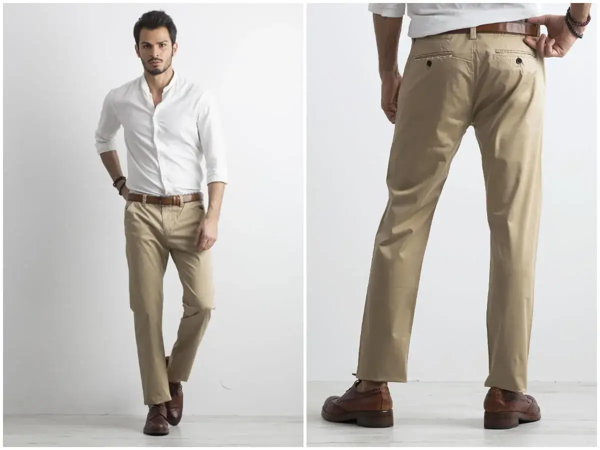 Mężczyzna w białej koszuli i beżowych spodniach chinosach. To klasyka, która pasuje na wiele okazji.