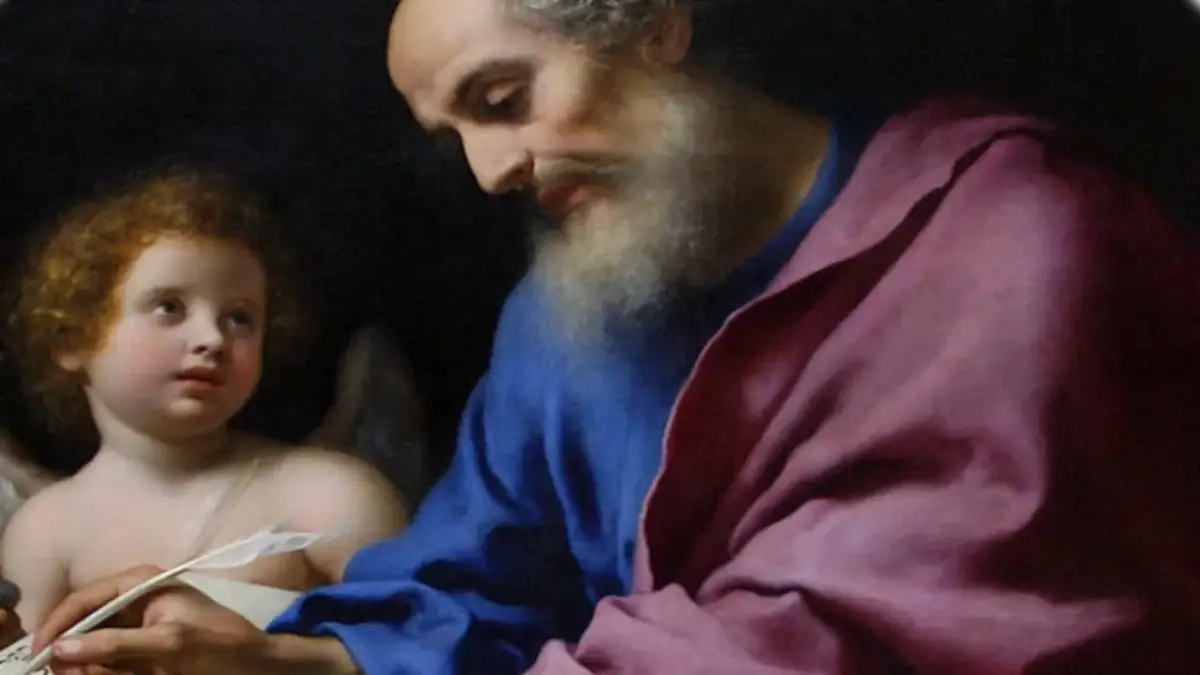 Św. Mateusz, autor Ewangelii, pisze pod dyktando anioła.