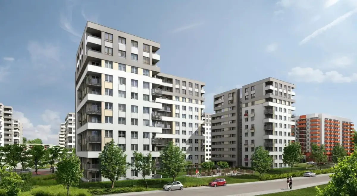 Nowoczesne budynki mieszkalne na osiedlu Avia Kraków. Zieleń, chodniki i samochody tworzą przyjazną przestrzeń.