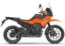 Pomarańczowy motocykl **KTM 390 Adventure** gotowy na przygodę.
