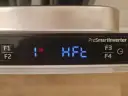 Panel zmywarki Beko: przyciski F1, F2, F3, F4, symbol "1s" i napis "HFE".