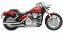 Błyszczący, czerwony motocykl Honda VTX 1300 z chromowanymi elementami i potężnym silnikiem.